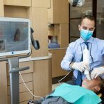 Dr. Wes Arbuckle with Patient | Absolute Dentistry | Family & General Dentist | Okotoks Dentist